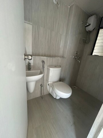Bathroom in 2 BHK Apartment at Runwal Gardens, Dombivli East – for Rent