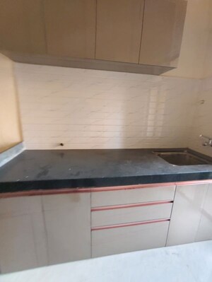 Kitchen in 1 BHK Apartment at Raunak Bliss Phase A3, Ghodbunder Road – for Rent