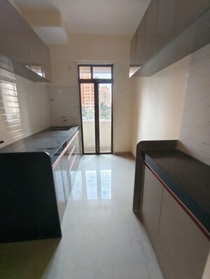 Kitchen in 1 BHK Apartment at Raunak Bliss Phase A3, Ghodbunder Road – for Rent