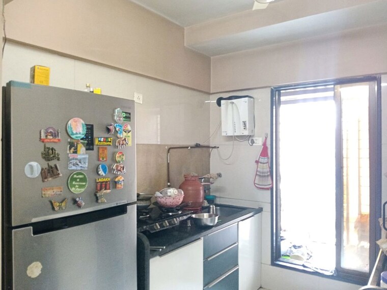 Kitchen, unique-greens-ghodbunder-road 2 Bedroom 700 Sq.Ft. Apartment In Ghodbunder Road Thane 10102350