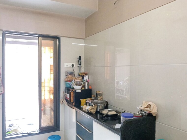 Kitchen, unique-greens-ghodbunder-road 2 Bedroom 700 Sq.Ft. Apartment In Ghodbunder Road Thane 10102350