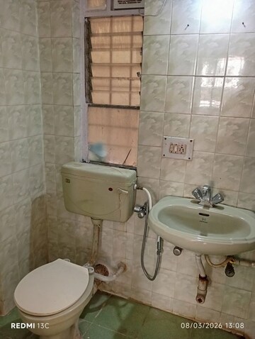 Bathroom in 2 BHK Apartment at Patil Raghukul Nagari CHS, Bopodi – for Sale