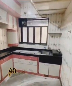 Kitchen in 1 BHK Apartment at New Omkar CHS, Dombivli West – for Sale