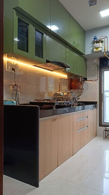 Kitchen in 2 BHK Apartment at Chincholi Apartment, Malad West – for Rent