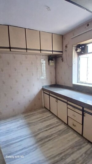 Kitchen in 2 BHK Apartment at Solitaire Heights, Malad West – for Rent