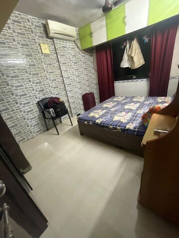 Bedroom in 2 BHK Apartment at Kulswamini Sai Balram Complex, Dombivli West – for Rent