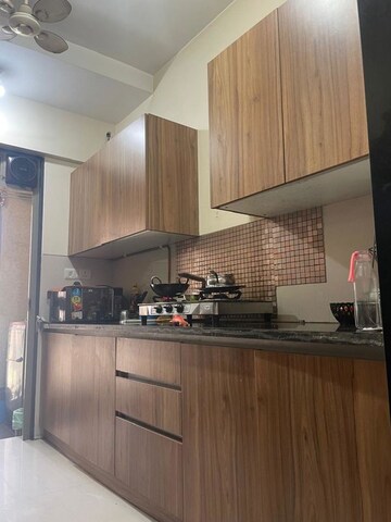 Kitchen in 2 BHK Apartment at Swastik Regalia, Waghbil – for Rent