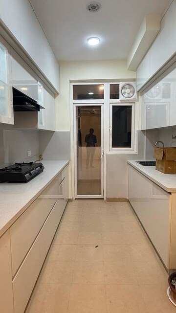 Kitchen in 3 BHK Apartment at Amrapali Heartbeat City, Sector 107 – for Rent