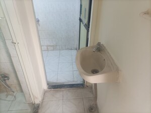 Bathroom in 1 BHK Apartment at Brahmand CHS, Brahmand – for Rent
