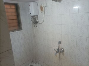 Bathroom in 1 BHK Apartment at Brahmand CHS, Brahmand – for Rent