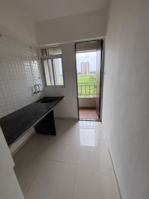 Building Lobby in 1 BHK Apartment at Ajinkya Towers, Charholi Budruk – for Rent