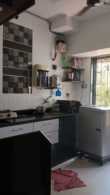 Kitchen in 1 BHK Apartment at Dharma Nagar CHS, Borivali West – for Sale