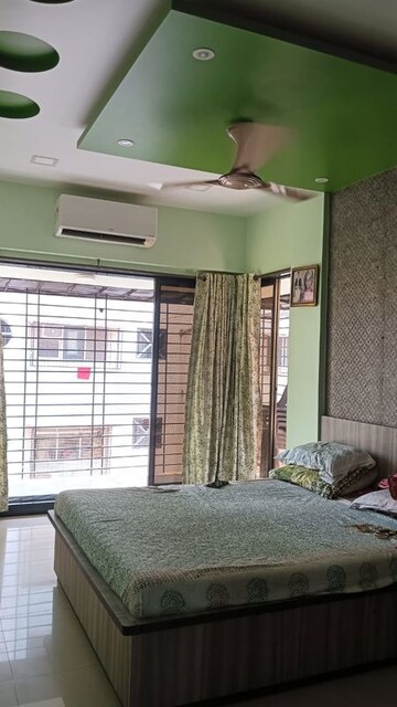 Bedroom in 1 BHK Apartment at Dharma Nagar CHS, Borivali West – for Sale