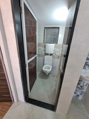 Bathroom in 1.5 BHK Apartment at Paradise Park, Katrap – for Sale