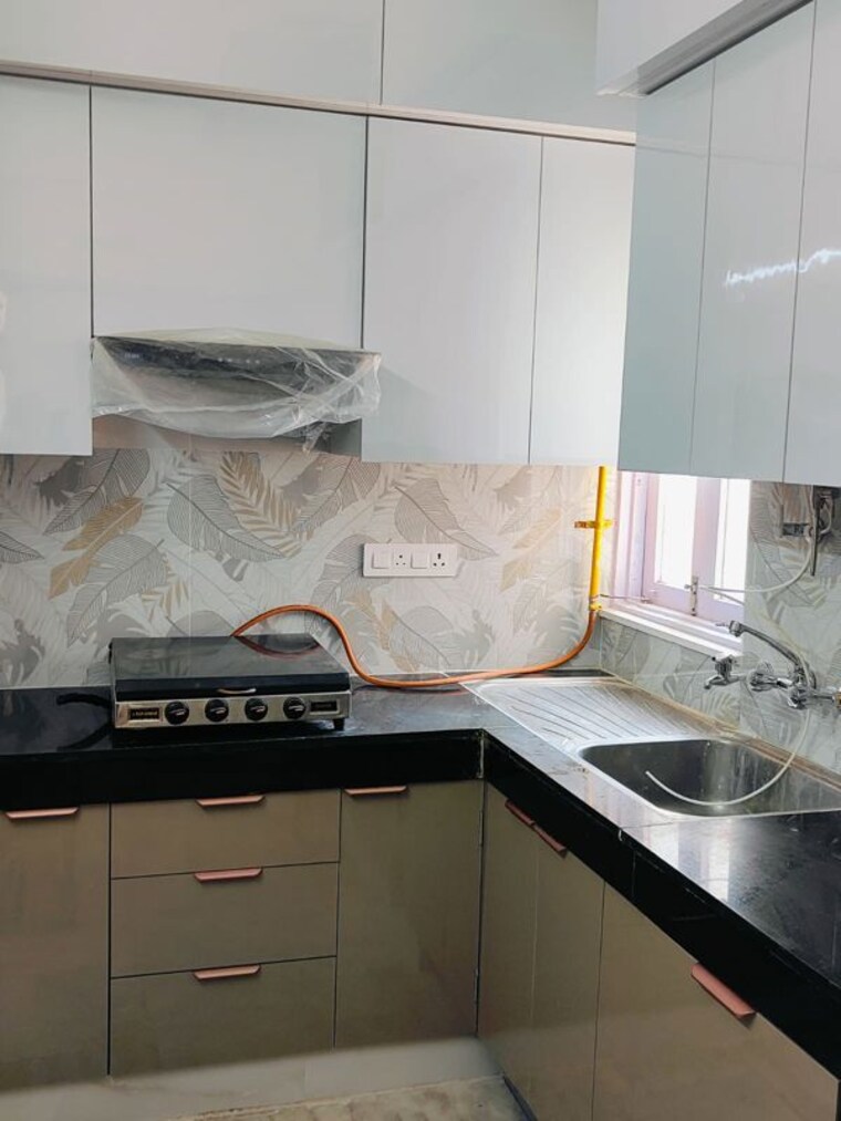 Kitchen, unitech-uniworld-gardens-2 3 Bedroom 1395 Sq.Ft. Apartment In Sector 47 Gurgaon 10110018