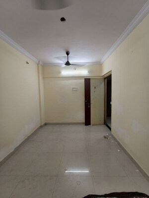 Living Room in 1 BHK Apartment at Gorai Shiv Shambhu CHS, Borivali West – for Rent