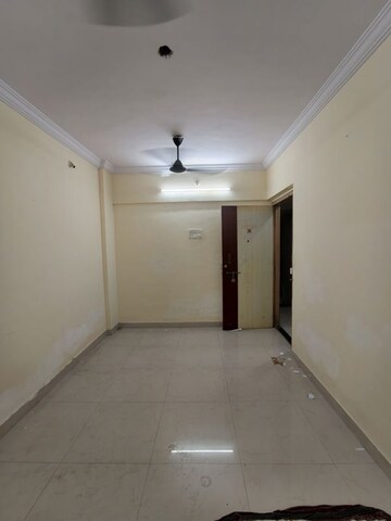 Living Room in 1 BHK Apartment at Gorai Shiv Shambhu CHS, Borivali West – for Rent