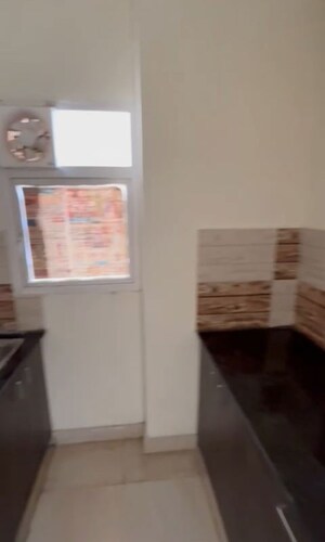 Kitchen in 2 BHK Apartment at Amrapali Dream Valley – for Rent