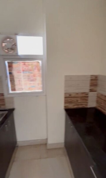 Kitchen in 2 BHK Apartment at Amrapali Dream Valley – for Rent