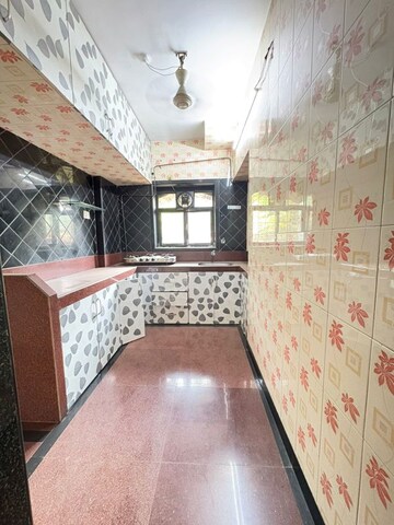 Kitchen in 2 BHK Apartment at Mhada CHS, Vasant Vihar – for Rent