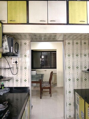 Kitchen in 2 BHK Apartment at Gala Pride Park, Manpada – for Rent