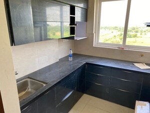 Kitchen in 1.5 BHK Apartment at Taruchaya Residency, Ajmer Road – for Sale