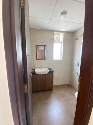 Bathroom in 2.5 BHK Builder Floor at Smart World Gems, Sector 89 – for Rent