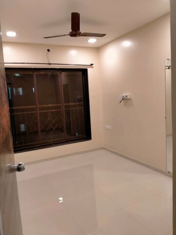 Living Room in 1 BHK Apartment at Riverdale Tower, Andheri East – for Rent
