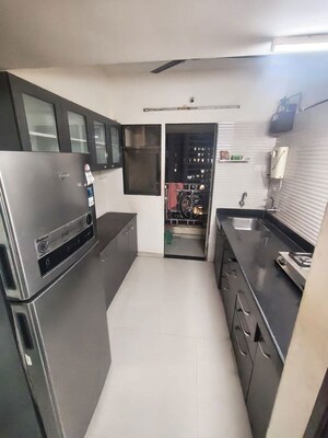 Kitchen in 1 BHK Apartment at Cosmos Jewels, Ghodbunder Road – for Sale