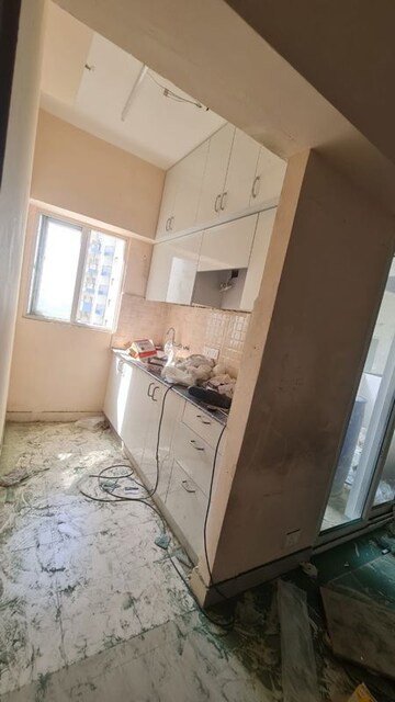 Kitchen in 1 BHK Apartment at Amrapali Dream Valley, Tech Zone 4 Greater Noida – for Rent