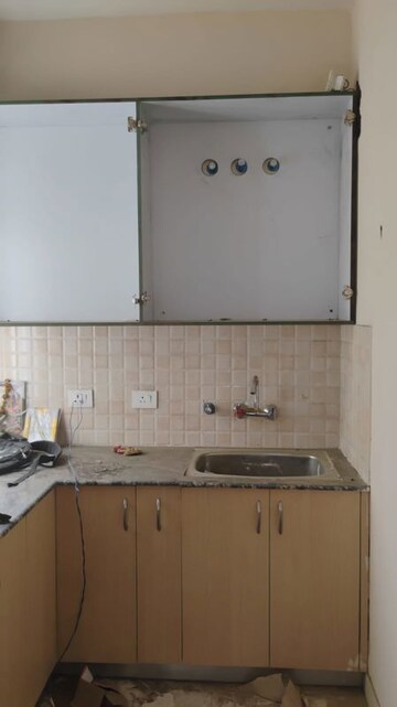 Kitchen in 1 BHK Apartment at Amrapali Dream Valley, Tech Zone 4 Greater Noida – for Rent