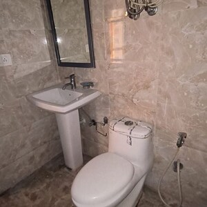 Bathroom in 1 RK Apartment at Supertech Czar Suites, Omicron I Greater Noida – for Sale
