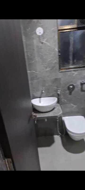 Bathroom in 1 BHK Apartment at Poonam Vaishno Heights, Malad East – for Rent