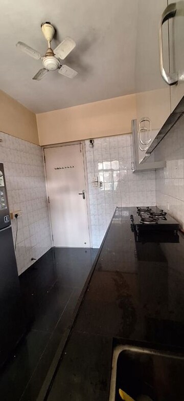 Kitchen in 3 BHK Apartment at Patel Palace, Andheri East – for Sale