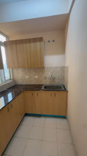 Kitchen in 2 BHK Apartment at Amrapali Enchante, Tech Zone 4 Greater Noida – for Rent