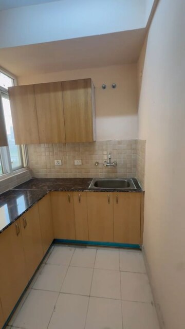 Kitchen in 2 BHK Apartment at Amrapali Enchante, Tech Zone 4 Greater Noida – for Rent