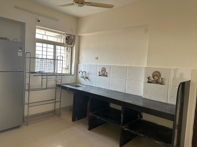 Kitchen, supertech-defence-colony-phase-ii 2 Bedroom 753 Sq.Ft. Apartment In Wagholi Pune 10116258