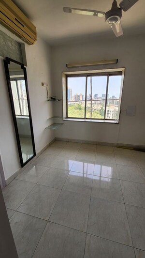 Room in 2 BHK Apartment at Suyog CHS Goregaon West, Goregaon West – for Rent
