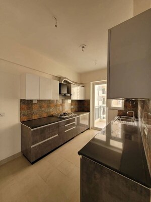 Kitchen in 3 BHK Apartment at Maya Green Lotus Utsav, International Airport Road – for Rent