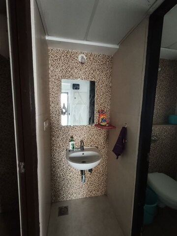 Bathroom in 1 BHK Apartment at Lodha Lakeshore Greens, Dombivli East – for Rent