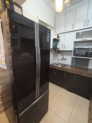 Kitchen in 2 BHK Apartment at Exotica Dreamville, Sector 16c Greater Noida – for Rent