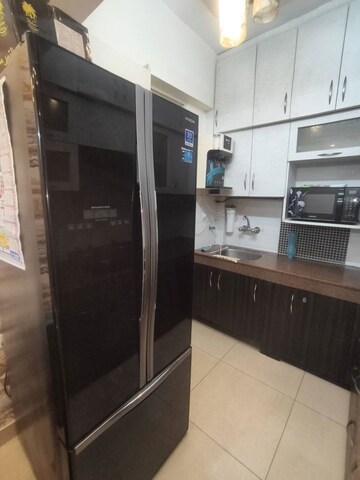 Kitchen in 2 BHK Apartment at Exotica Dreamville, Sector 16c Greater Noida – for Rent