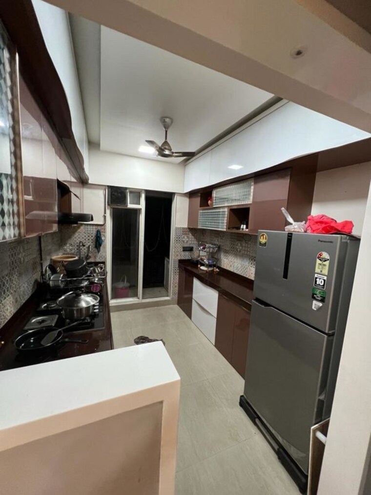 Kitchen, rosa-gardenia 2 Bedroom 650 Sq.Ft. Apartment In Ghodbunder Road Thane 10121576