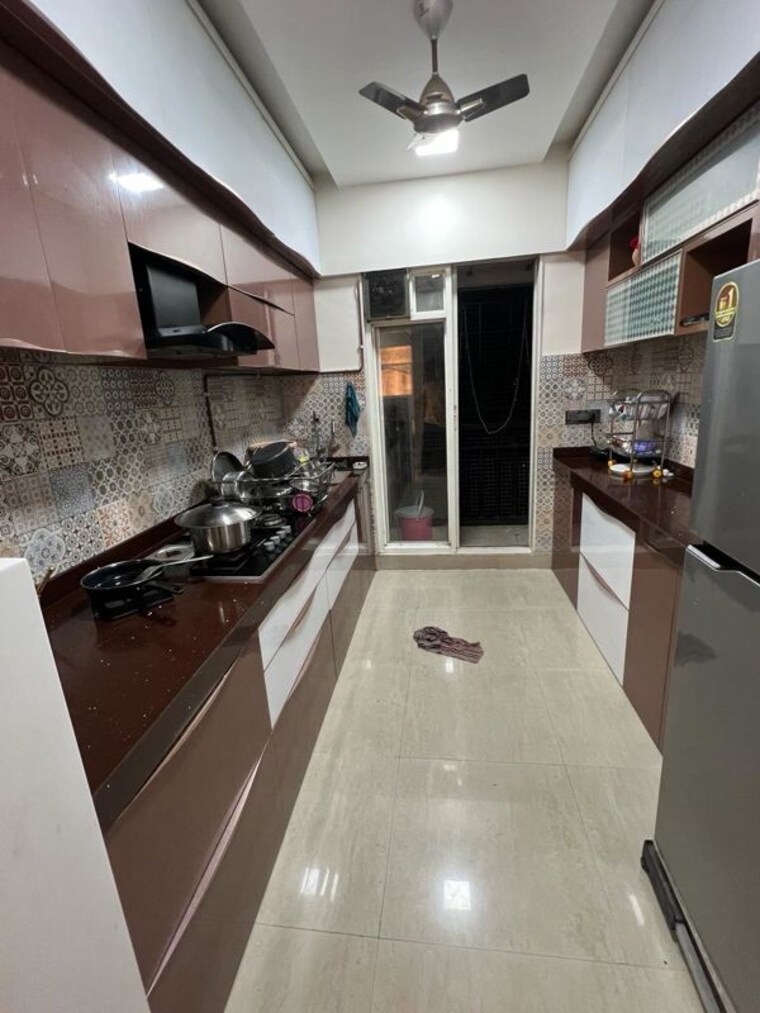 Kitchen, rosa-gardenia 2 Bedroom 750 Sq.Ft. Apartment In Ghodbunder Road Thane 10121585