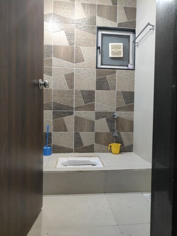 Bathroom in 3 BHK Apartment at Aagam Waves Surat, Choryasi – for Rent