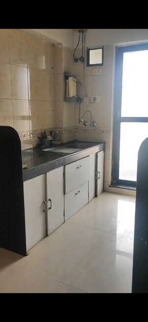 Kitchen in 2 BHK Apartment at Raheja Interface Heights, Malad West – for Rent