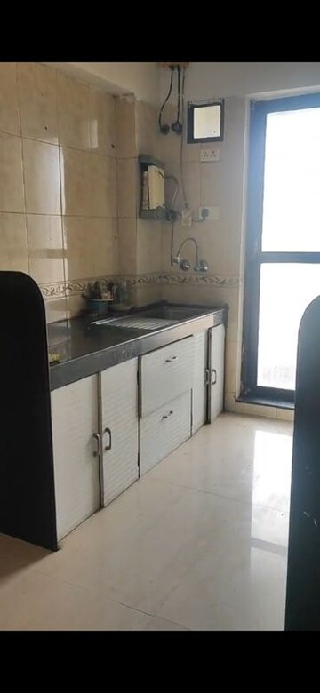 Kitchen in 2 BHK Apartment at Raheja Interface Heights, Malad West – for Rent