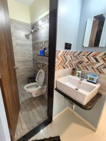 Bathroom in 2 BHK Apartment at Krishna Amorapolis, Dhanori – for Rent