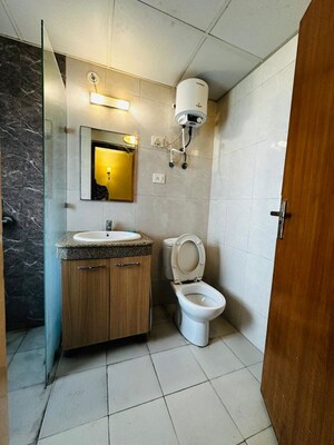 Bathroom in 1 RK Apartment at Nimbus The Golden Palm, Sector 168 – for Rent