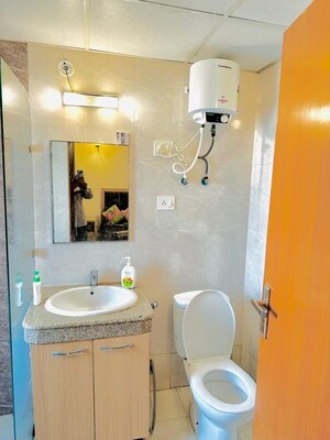 Bathroom in Studio Apartment at Nimbus The Golden Palm, Sector 168 – for Rent